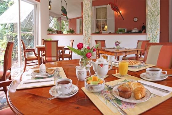 Veranda Breakfast featuring coffee, cupcakes, croissants and fresh fruits served at Royal Palms Hotel