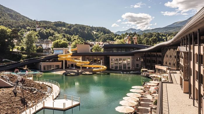 Exterior view of Falkensteiner Family Resort Lido with a pool, water slide and loungers