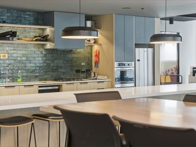 Modern kitchen with dining area and appliances in Mayoral Drive Student Accommodation.