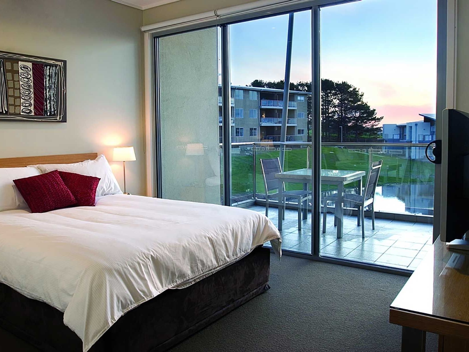 Resort Rooms bedroom with kingbed & a TV at Silverwater Resort