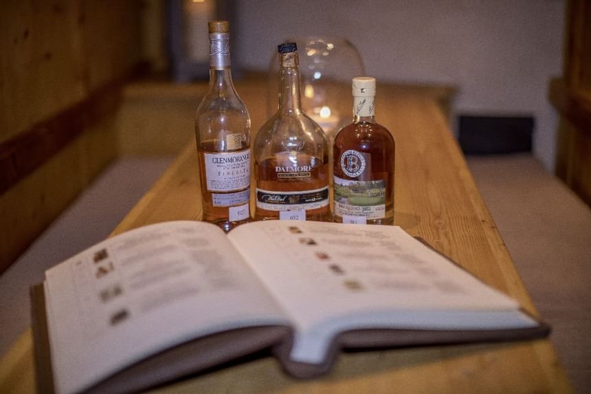 Close-up of 3 whiskey bottles in Lounge Bar at Liebes Rot Flueh