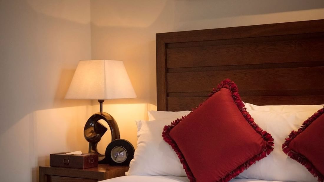 Bed & nightstand in King Room River View at Guoman Hotels