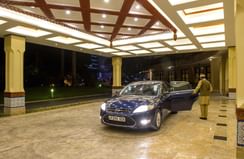 A Concierge opening the car door at Dar Es Saalam Serena Hotel