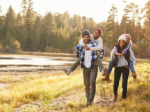 family walking in woods