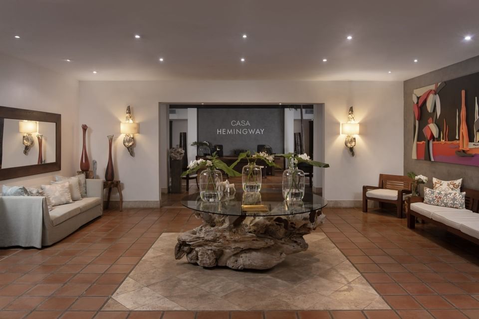 Lobby area with tree stump table & sofas at Club Hemingway