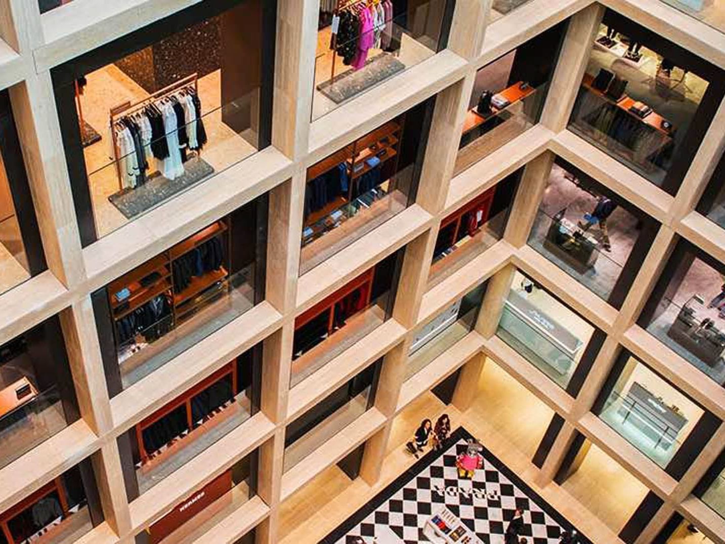 Aerial view of Rinascente Rome with geometric clothing displays and a checkered floor near The Republic Hotel