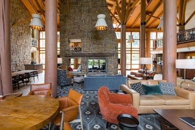 Lobby lounge area with sofas & dining tables at Alderbrook Resort & Spa