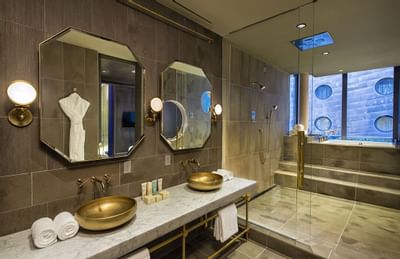 A fully marbled bathroom in Guesthouse at Dream Downtown NYC
