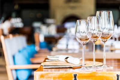 Close-up of wine glasses on a table at Azalai Hotel Dakar