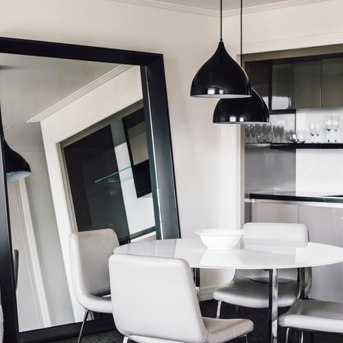 Dining table & large mirror in Junior Suite at Como Melbourne