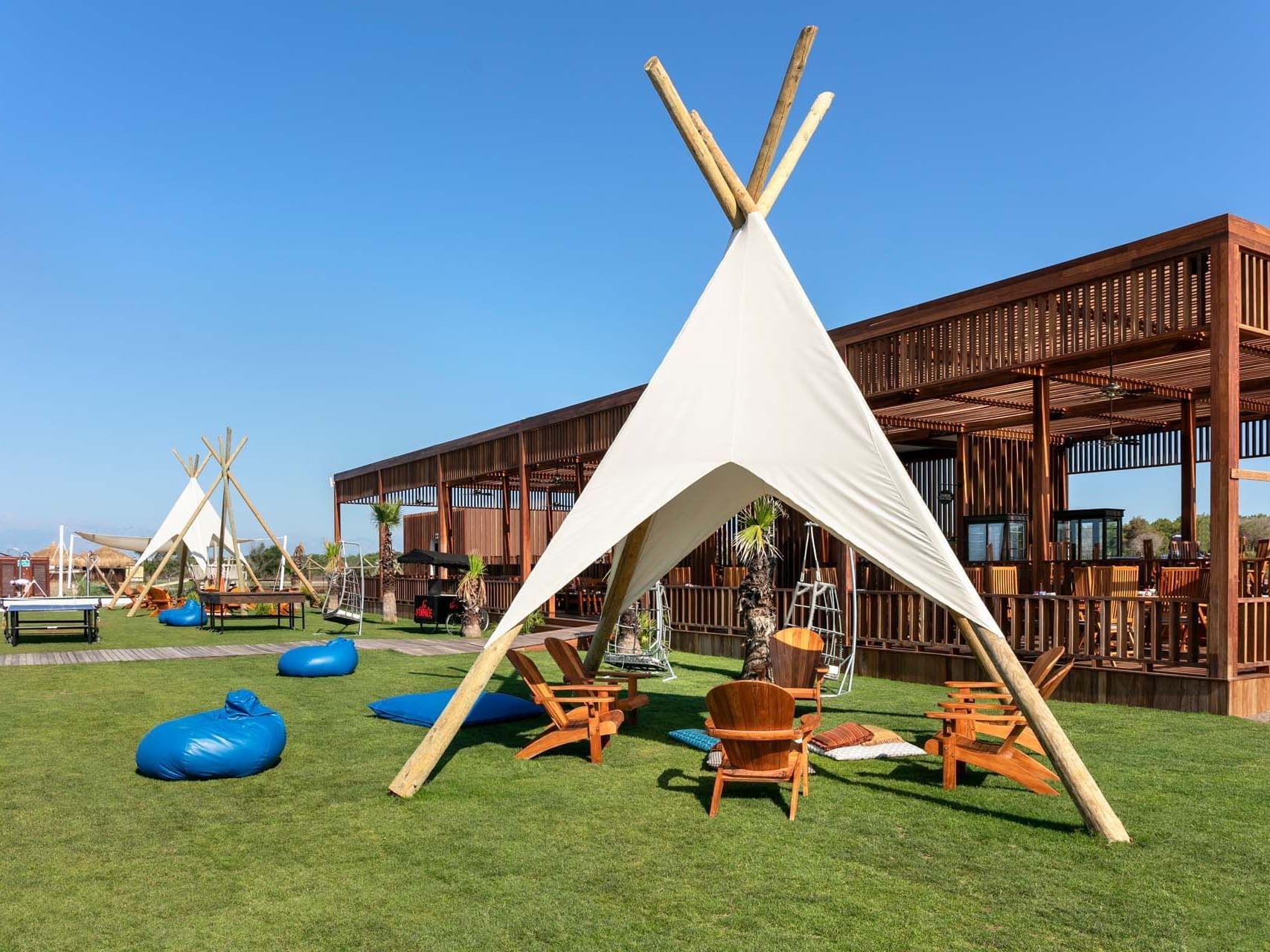 A camping tent arranged outdoors on a sunny day in Palm Bar at Titanic Deluxe Golf Belek