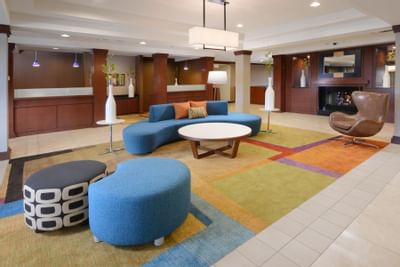 lobby with blue seating and fireplace