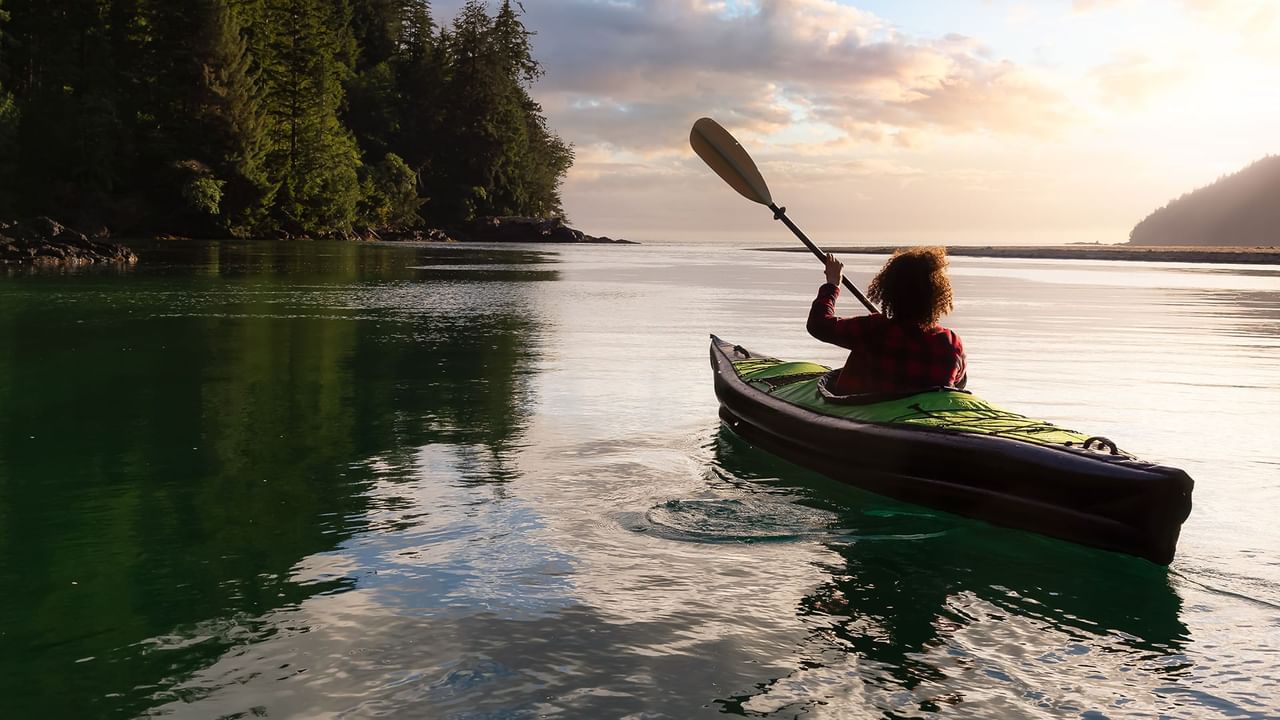 girl kayaking in the pacific ocean