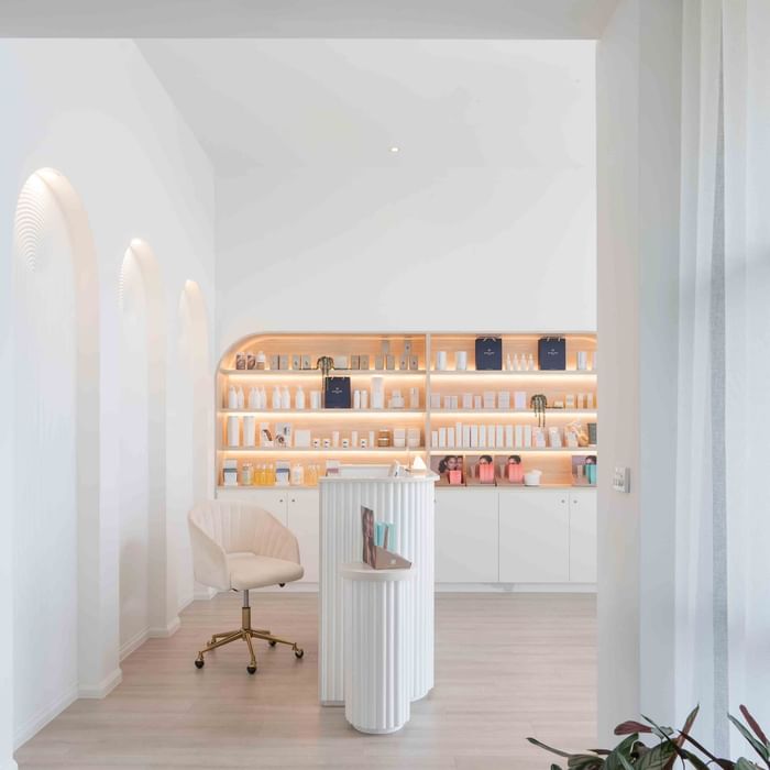 Beauty salon interior with products on shelves and elegant chair at Mercure Kooindah Waters