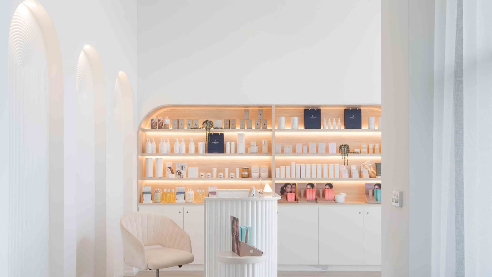 Beauty salon interior with products on shelves and elegant chair at Mercure Kooindah Waters