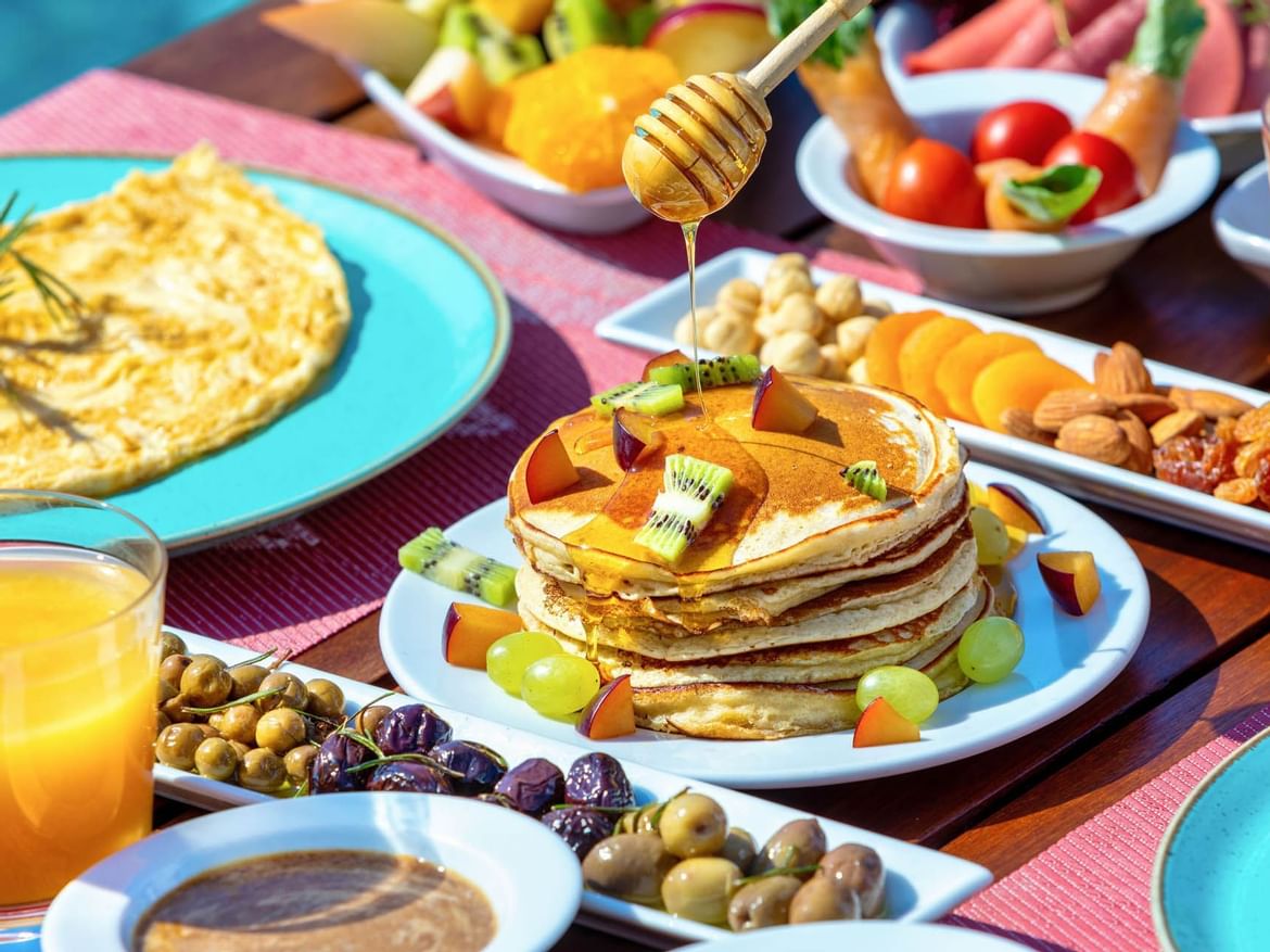Served dishes on a table in Sitara Restaurant at Senses Hotel