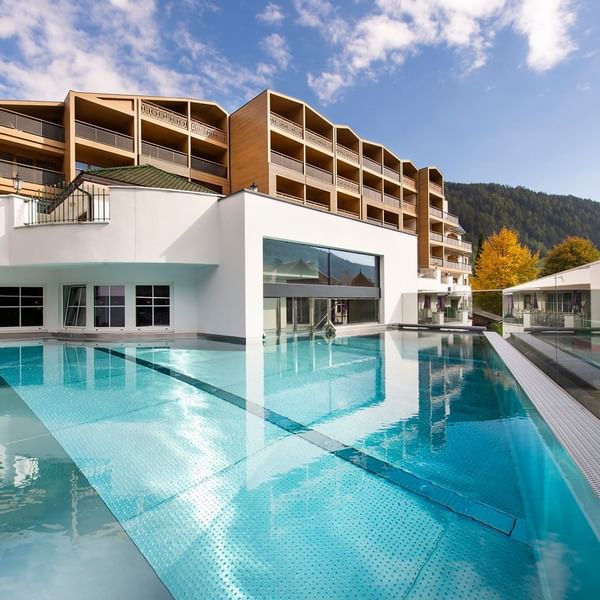 Hotel exterior & outdoor swimming pool at Falkensteiner Hotels