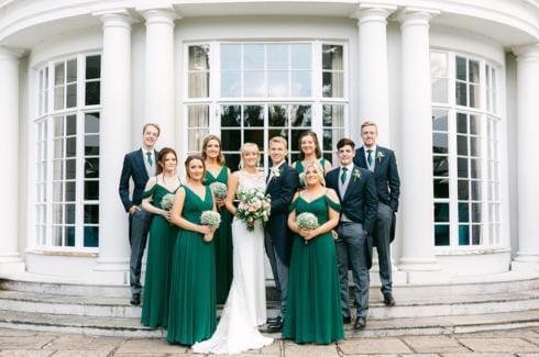 bridesmaids, groomsmen, groom and bride outside of gorse hill in surrey