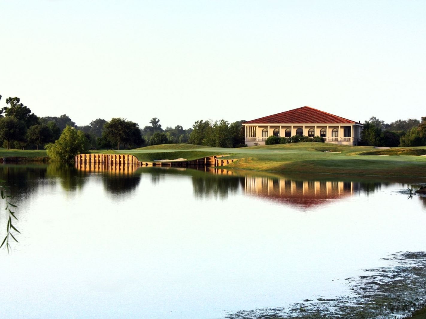 Fairway reflected in water at University Club