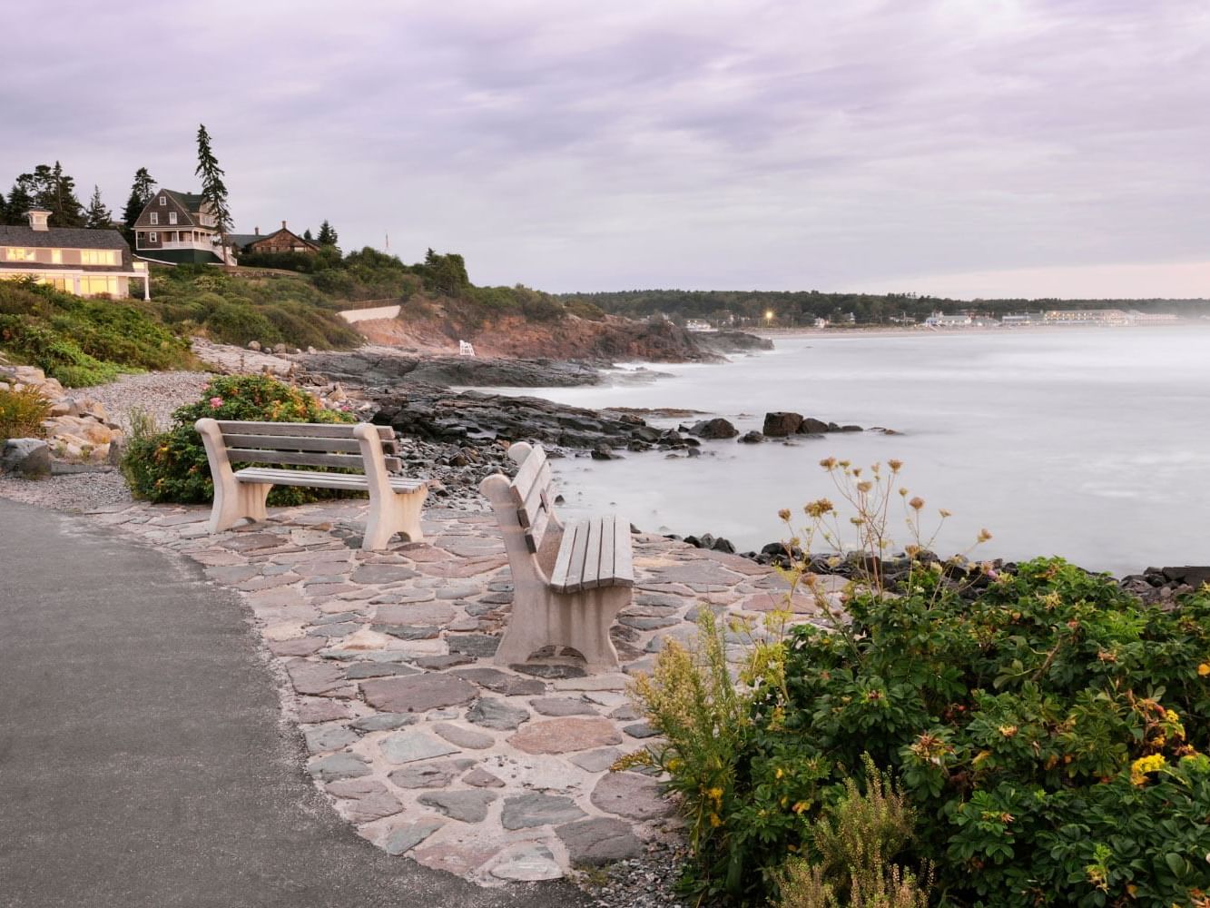Cliffside view with a bench overlooking the picturesque coastal trail near Juniper Hill Inn