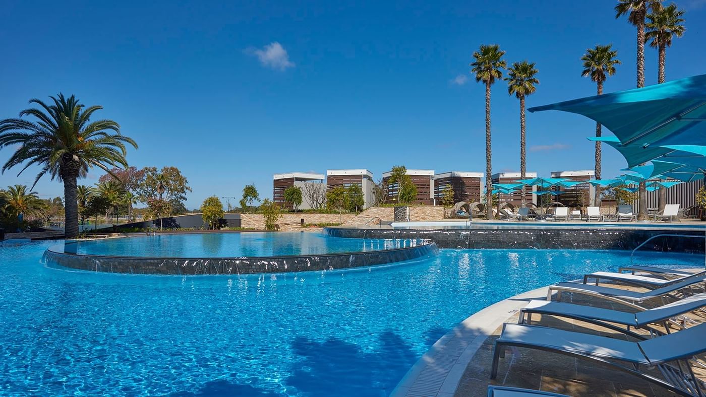 Pool with sun loungers at Crown Hotels