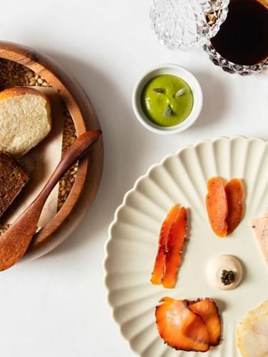 Assorted charcuterie & artisanal bread slices served at The Capital Hotel, Apartments and Townhouse