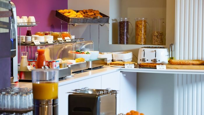 Snack buffet with a soft drink dispenser at Hotel du chateau