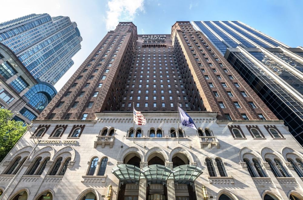 Tall hotel with arched windows, USA flag, and 