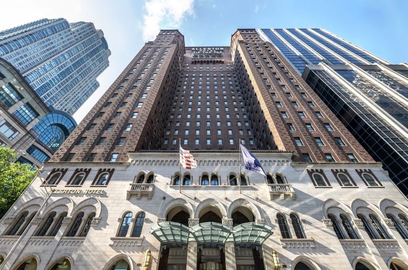 Tall hotel with arched windows, USA flag, and 
