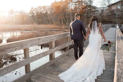 bride and groom walking over bride