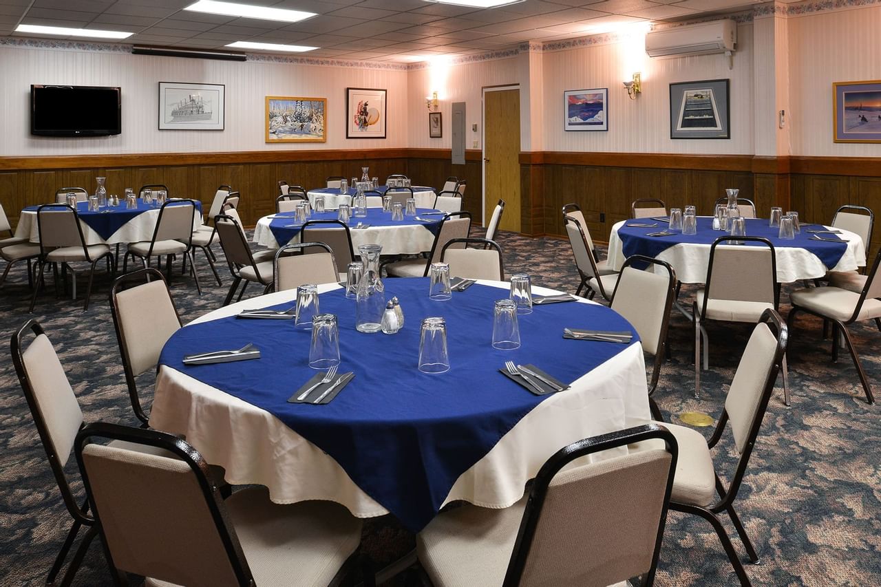 Round tables set in large meeting room