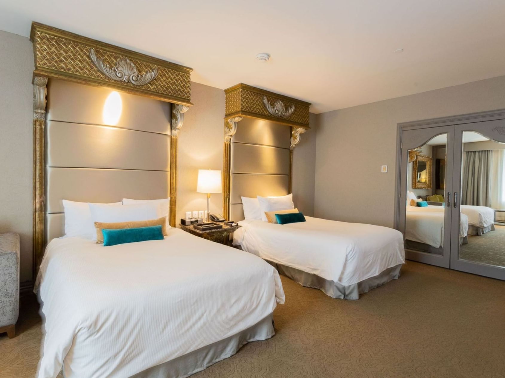 2 Double Executive Tower featuring mirrored closet doors and elegant gold accents at Quinta Real Monterrey