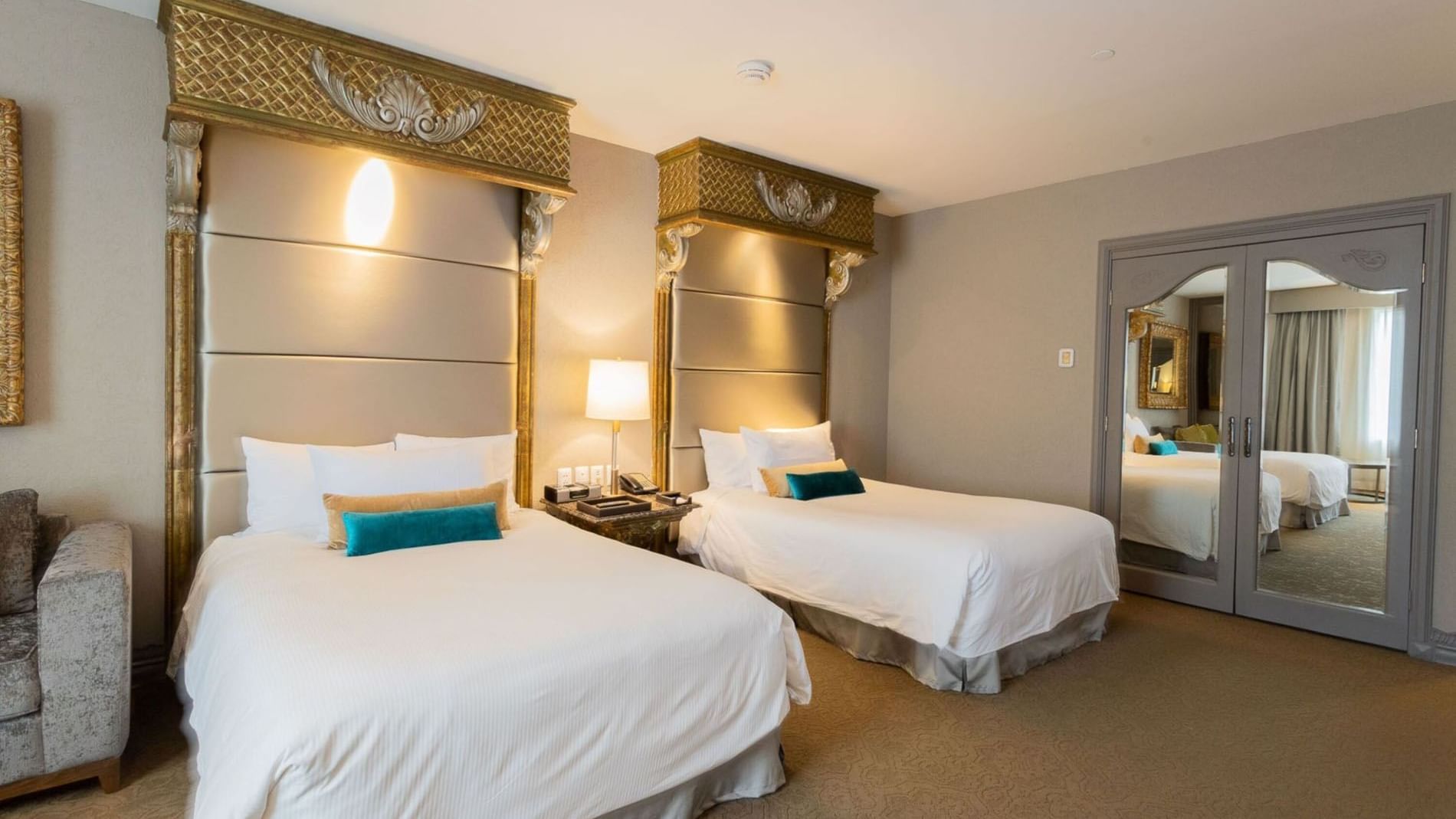 2 Double Executive Tower featuring mirrored closet doors and elegant gold accents at Quinta Real Monterrey