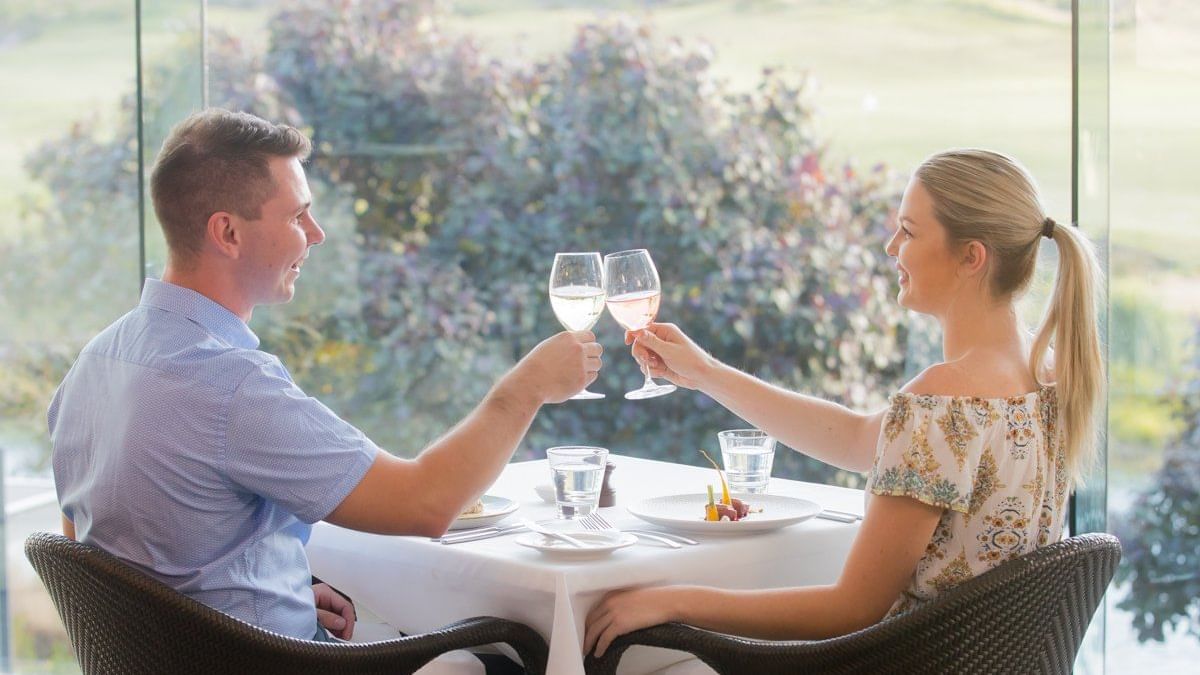 Couple cheering glass of wine at Barretts Restaurant