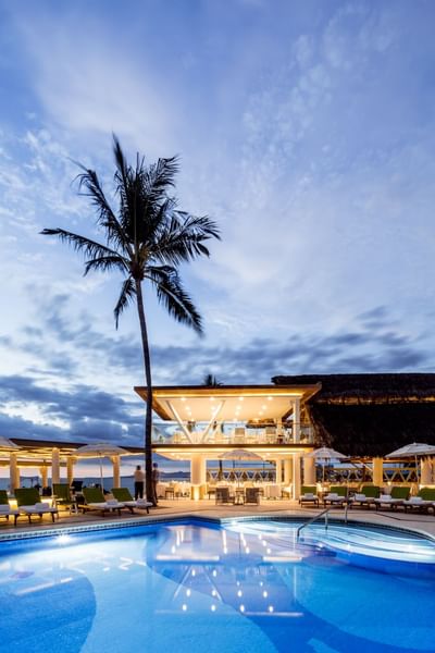 Scenic view of pool area at night by Villa Premiere Boutique Hotel & Romantic Getaway