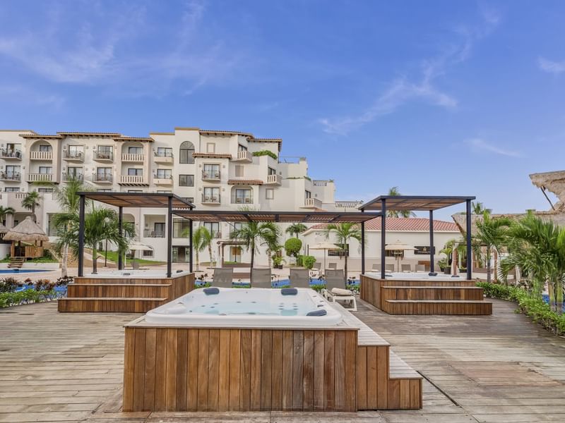 Outdoor Jacuzzi near pool at FA Hotels & Resorts
