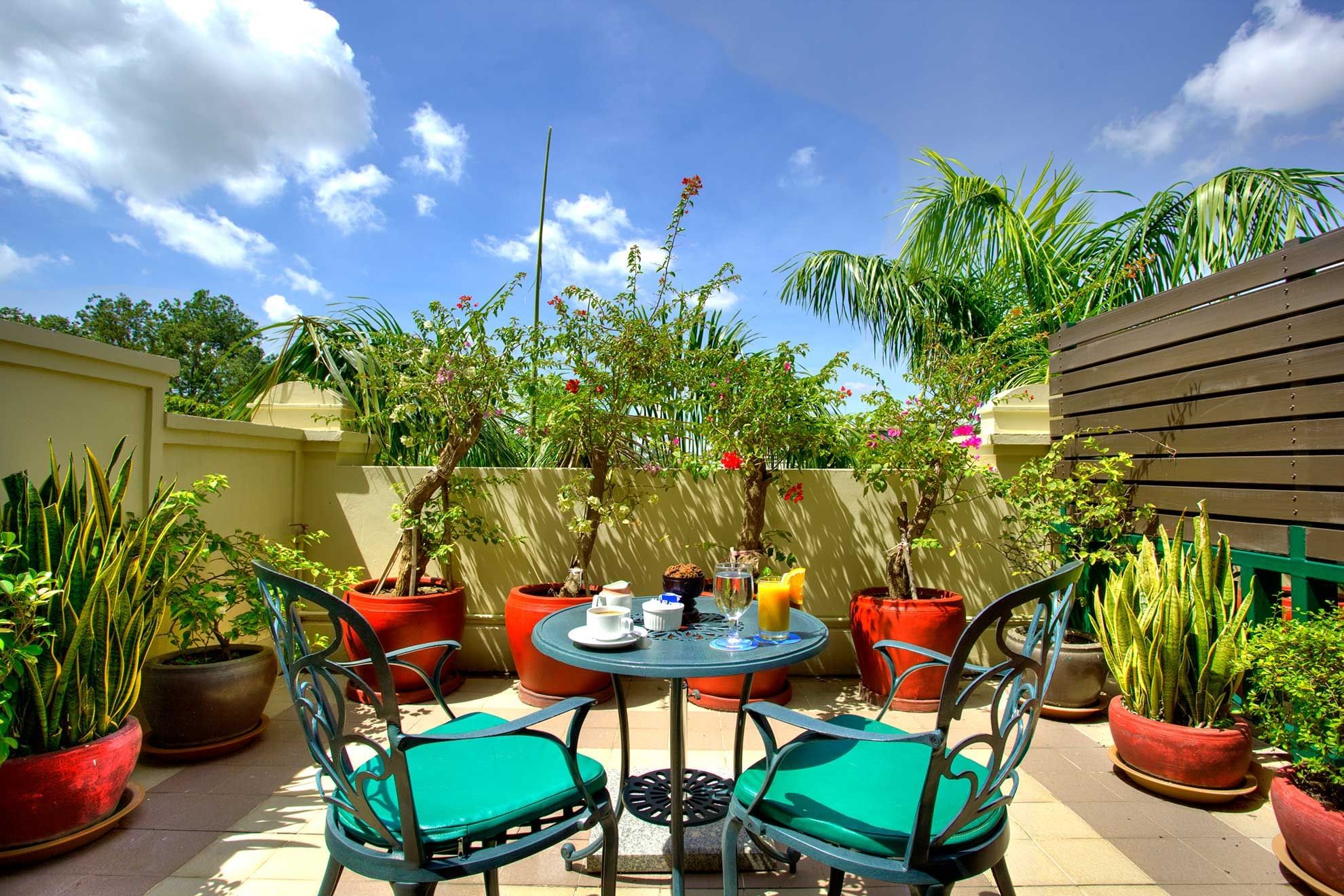 Private balcony with garden and Wat Phnom Pagoda view at Sunway Hotel Phnom Penh
