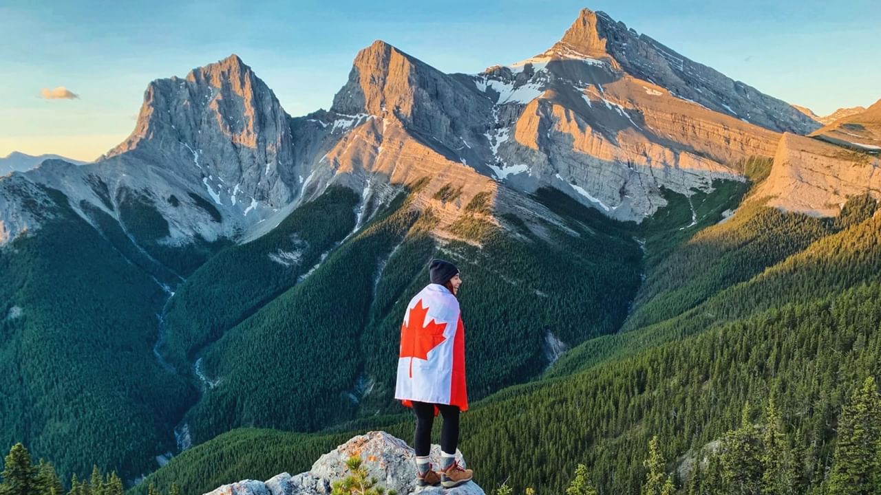 A person wrapped in a Canadian flag