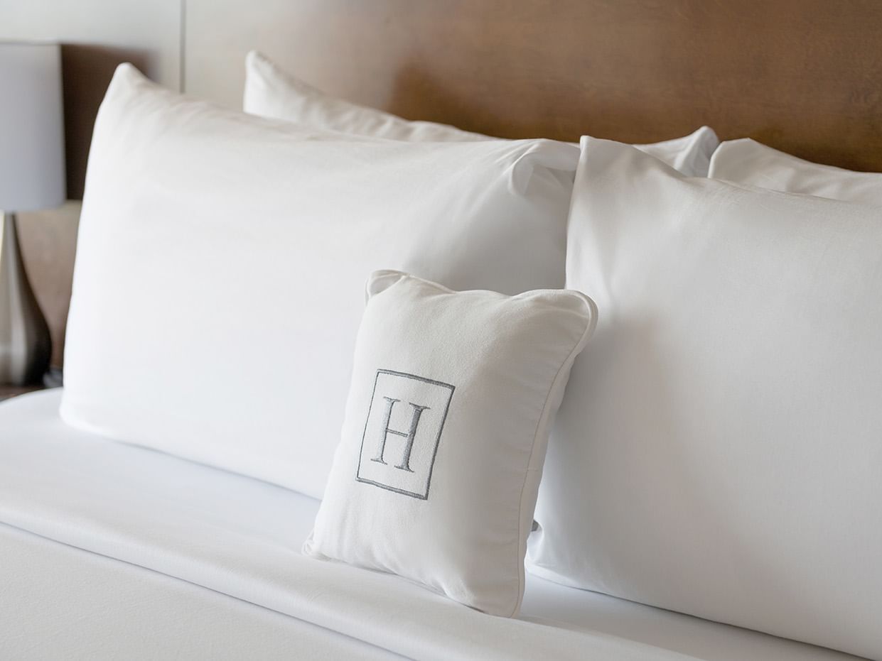 Close-up of Harborside pillows on a bed at Harborside Hotel
