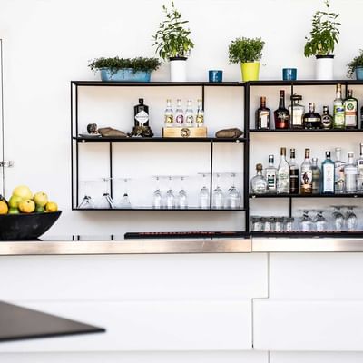 Liquor bottles on shelves at Pool Bar, Falkensteiner Hotels