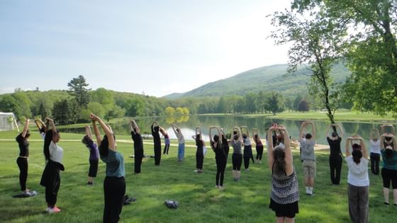 People engaged in meditating activity near Honor’s Haven Retreat