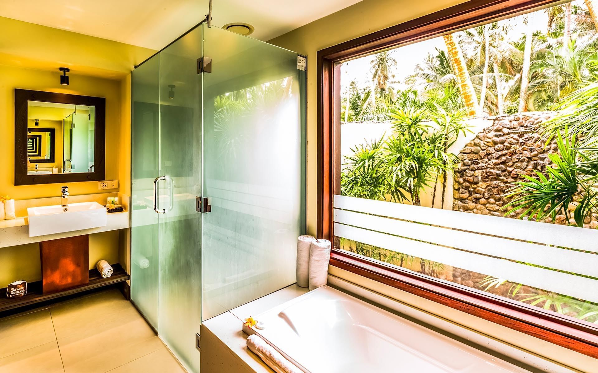 Beach Front Bure with Plunge Pools bathroom at Tambua Sands