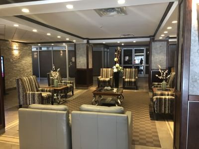 Luxury hotel lobby with cozy seating at Fort McMurray Hotel
