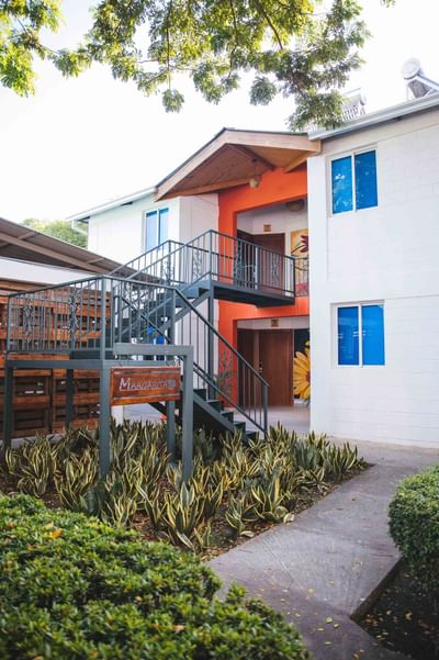 Hotel exterior of Cha Cha Hotel with staircase leading to the entrance