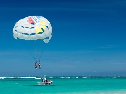 People parasailing on Waikiki Beach near Waikiki Resort Hotel