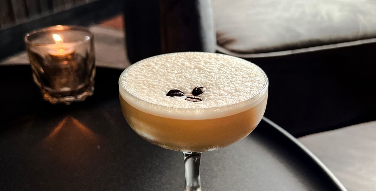 Close-up of a coffee cocktail served at Midnight Sun, a Coast Hotel
