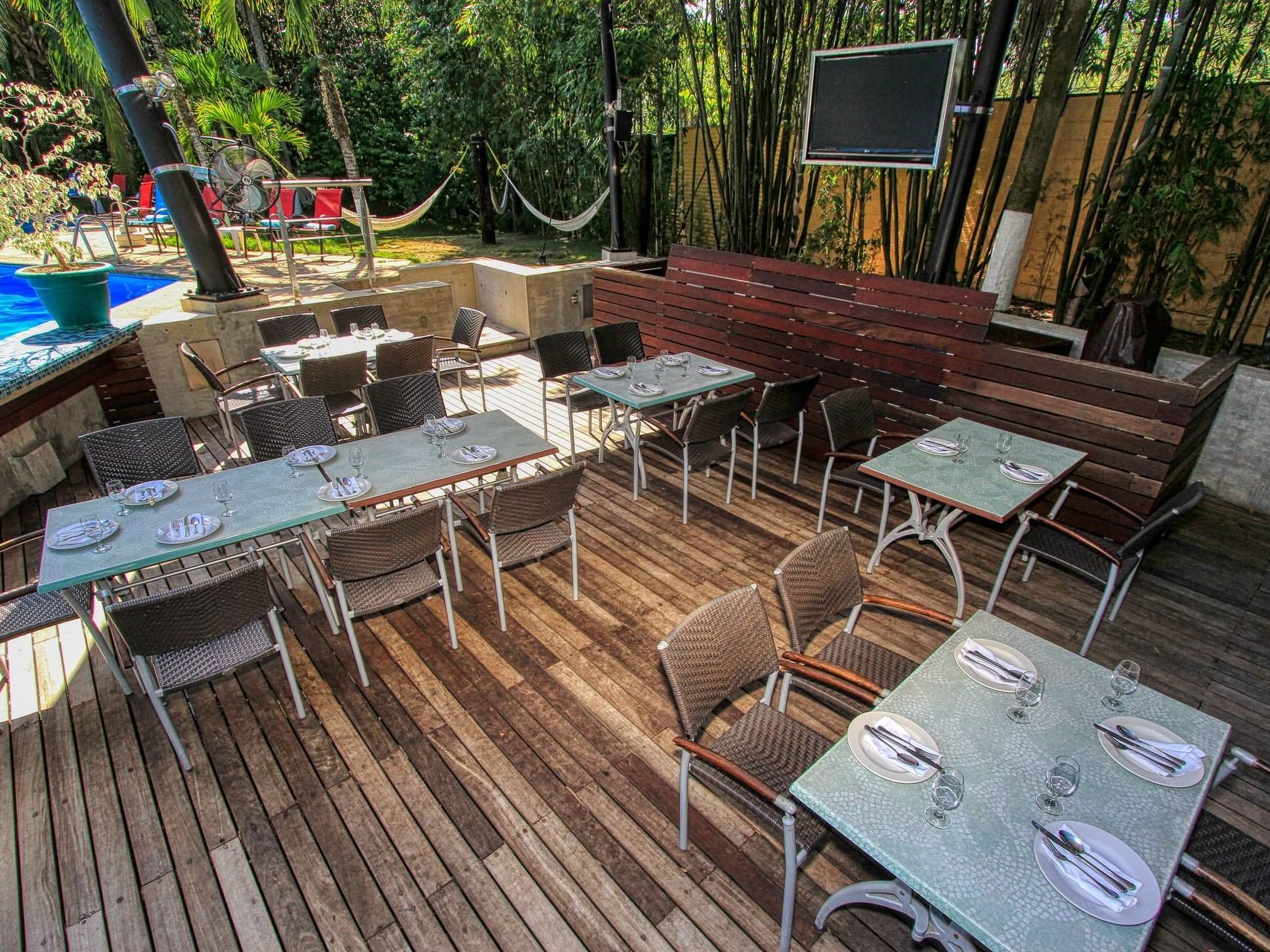 Dining area by the pool in The Palms at Ciudad Real Palenque