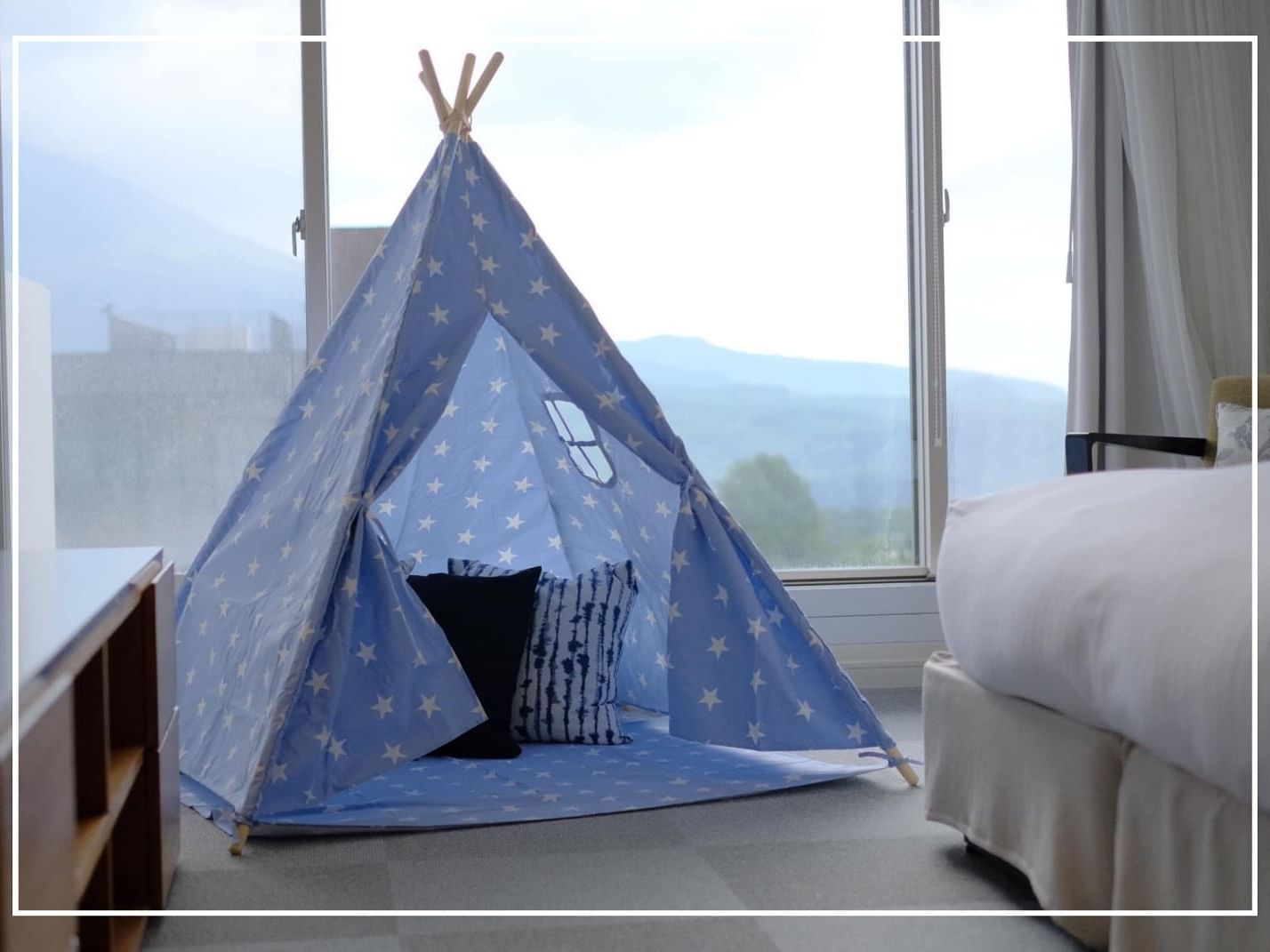 A teepee tent in a room & a city view at Chatrium Niseko japan