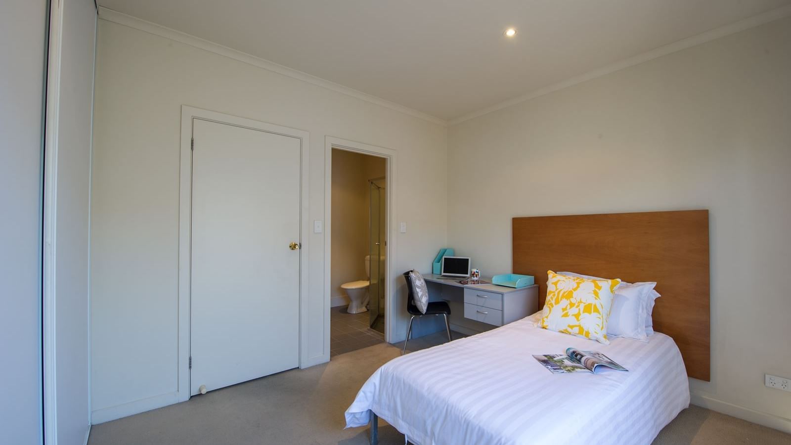 Student Living Edge Apartments – Gray Street Building - Typical bedroom with single bed, study desk & chair, built in wardrobe & with ensuite