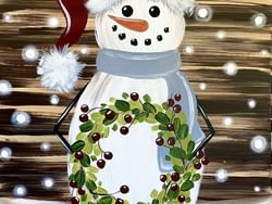snowman painting holding a green wreath 